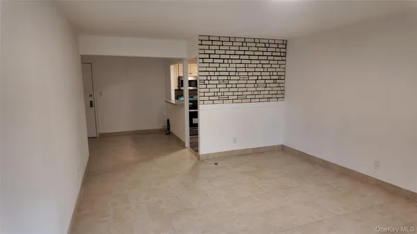 a kitchen with a refrigerator and a sink