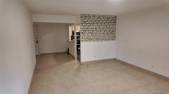 a kitchen with a refrigerator and a sink
