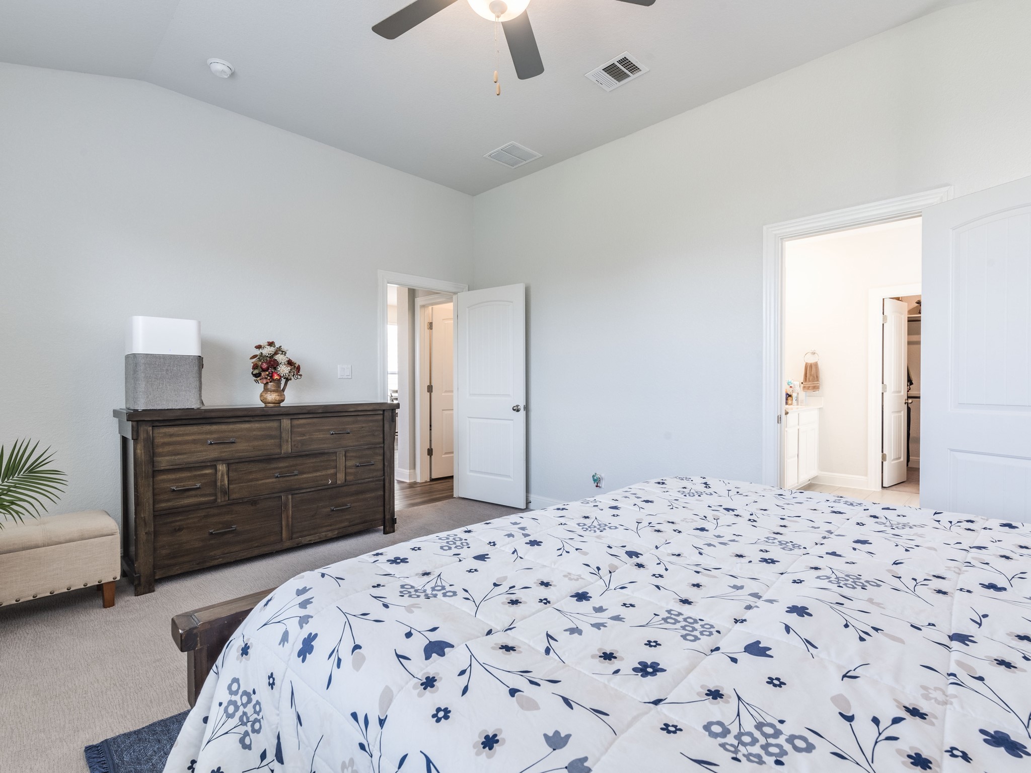 142 Mount Locke Road Dripping Springs, TX 78620 - Photo 12 of 31 a bedroom with a bed and a dresser