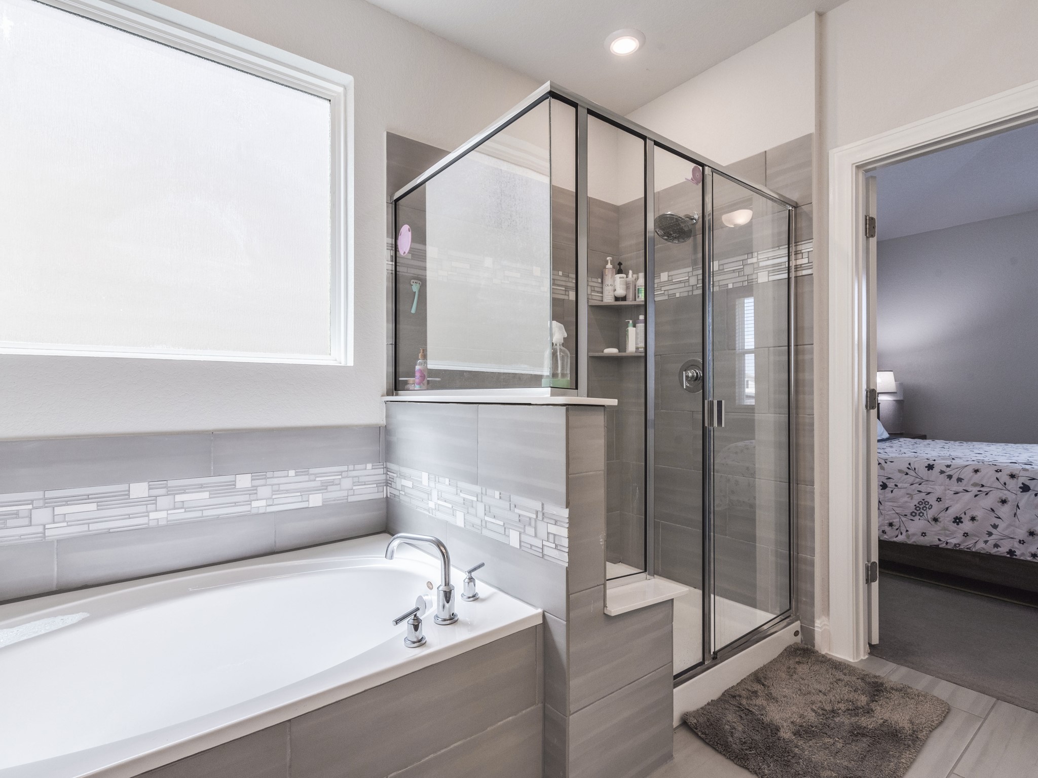 142 Mount Locke Road Dripping Springs, TX 78620 - Photo 14 of 31 a bathroom with a tub and shower