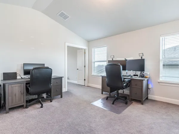 a bathroom with a sink toilet and a mirror