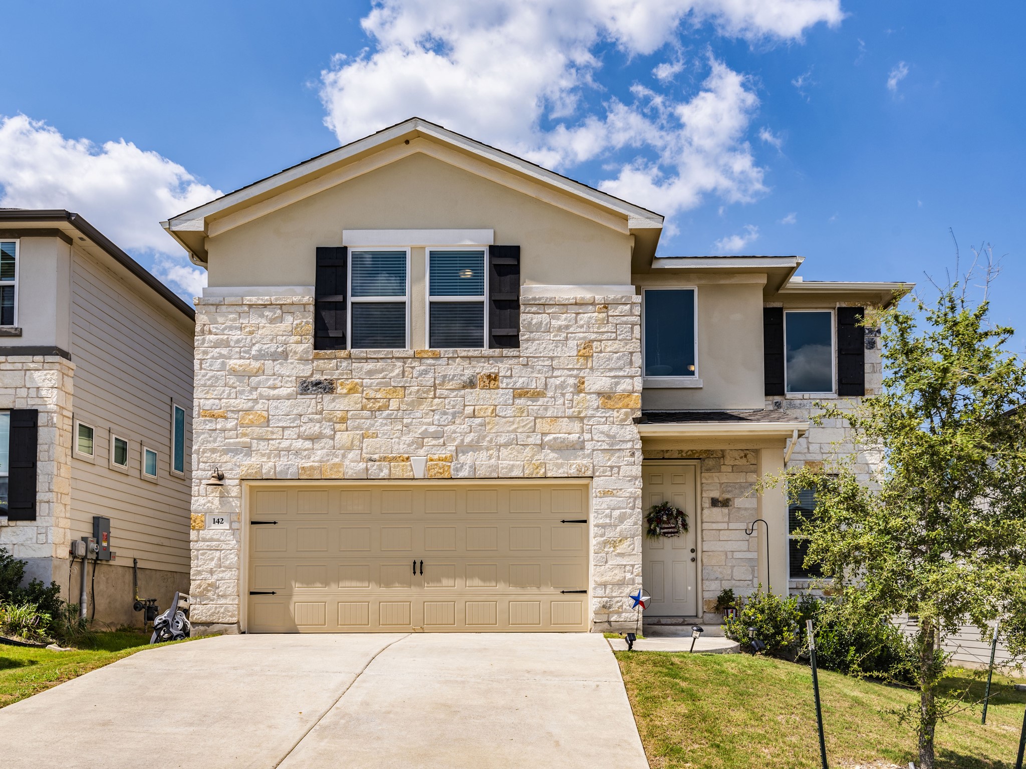 142 Mount Locke Road Dripping Springs, TX 78620 - Photo 2 of 31 a front view of a house with yard