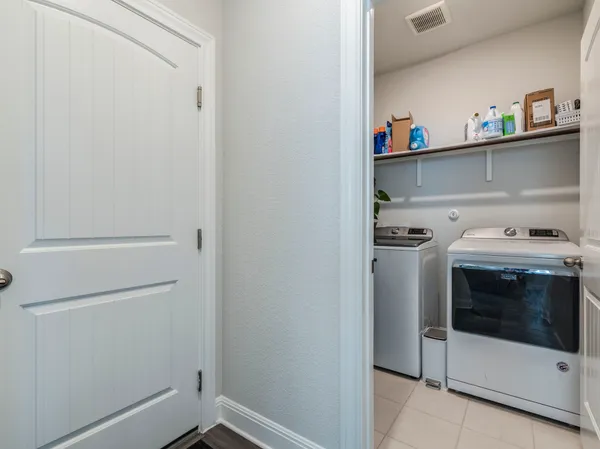 a bathroom with a sink a vanity and shower