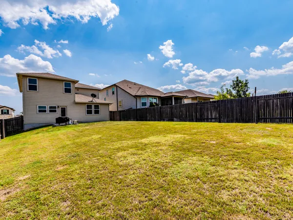 a view of a large swimming pool with an outdoor seating