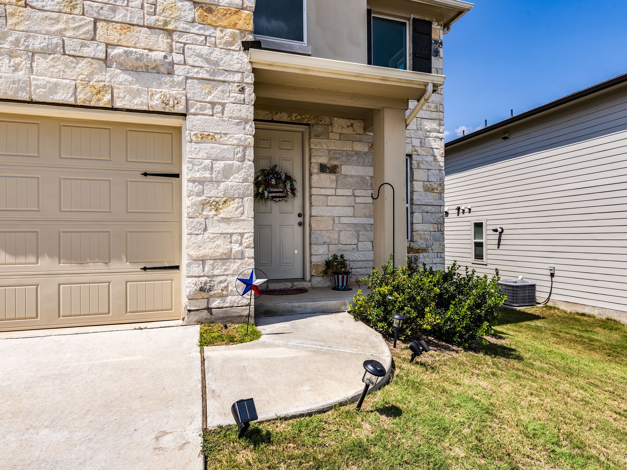 142 Mount Locke Road Dripping Springs, TX 78620 - Photo 4 of 31 a front view of a house with large windows