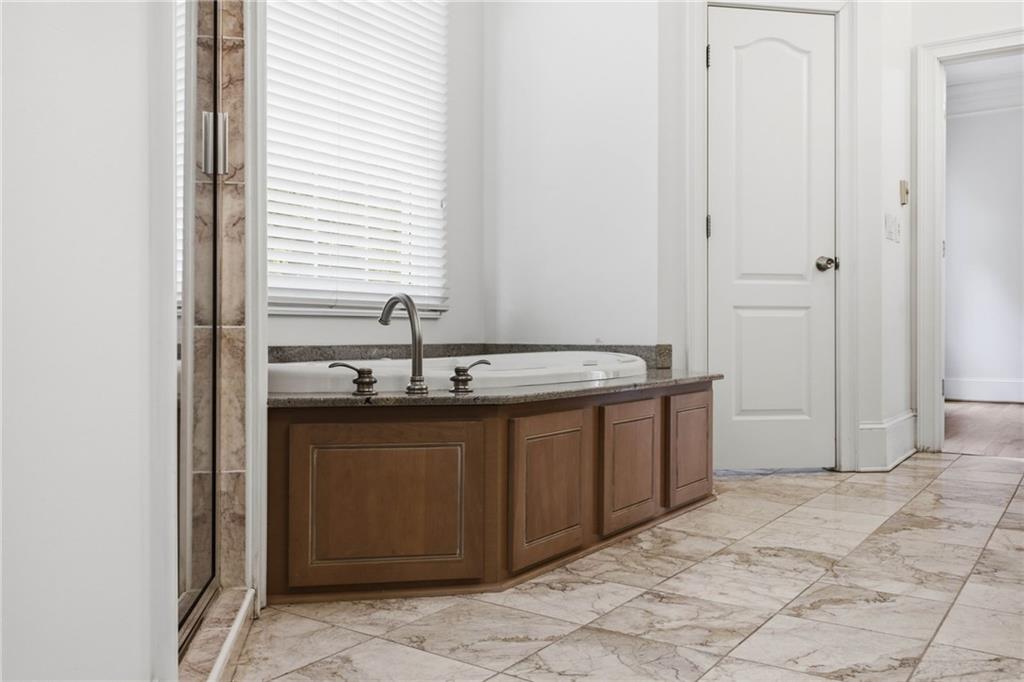 5 St Andrews Way Rome, GA 30165 - Photo 37 of 75 a bathroom with a sink and a mirror