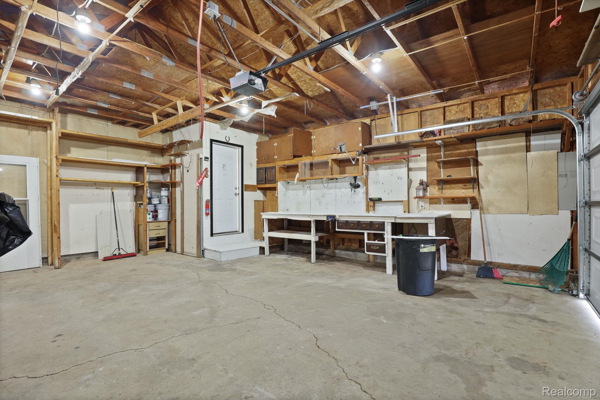3937 Curtis Road Birch Run, MI 48415 - Photo 26 of 33 Garage featuring a garage door opener
