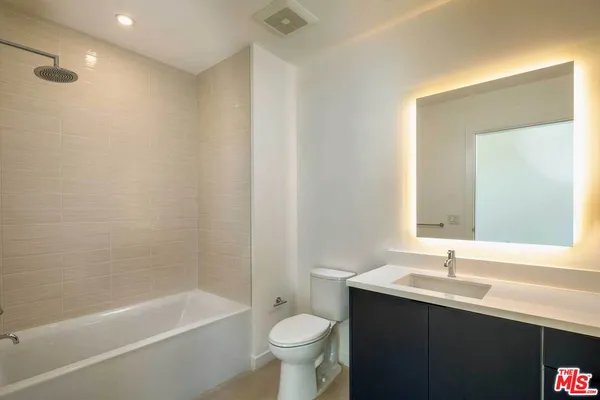 a bathroom with a sink a toilet and a bathtub