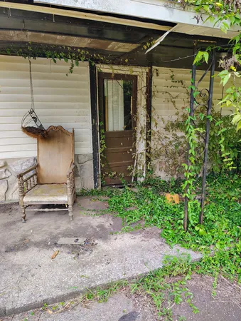 a view of backyard with cabin
