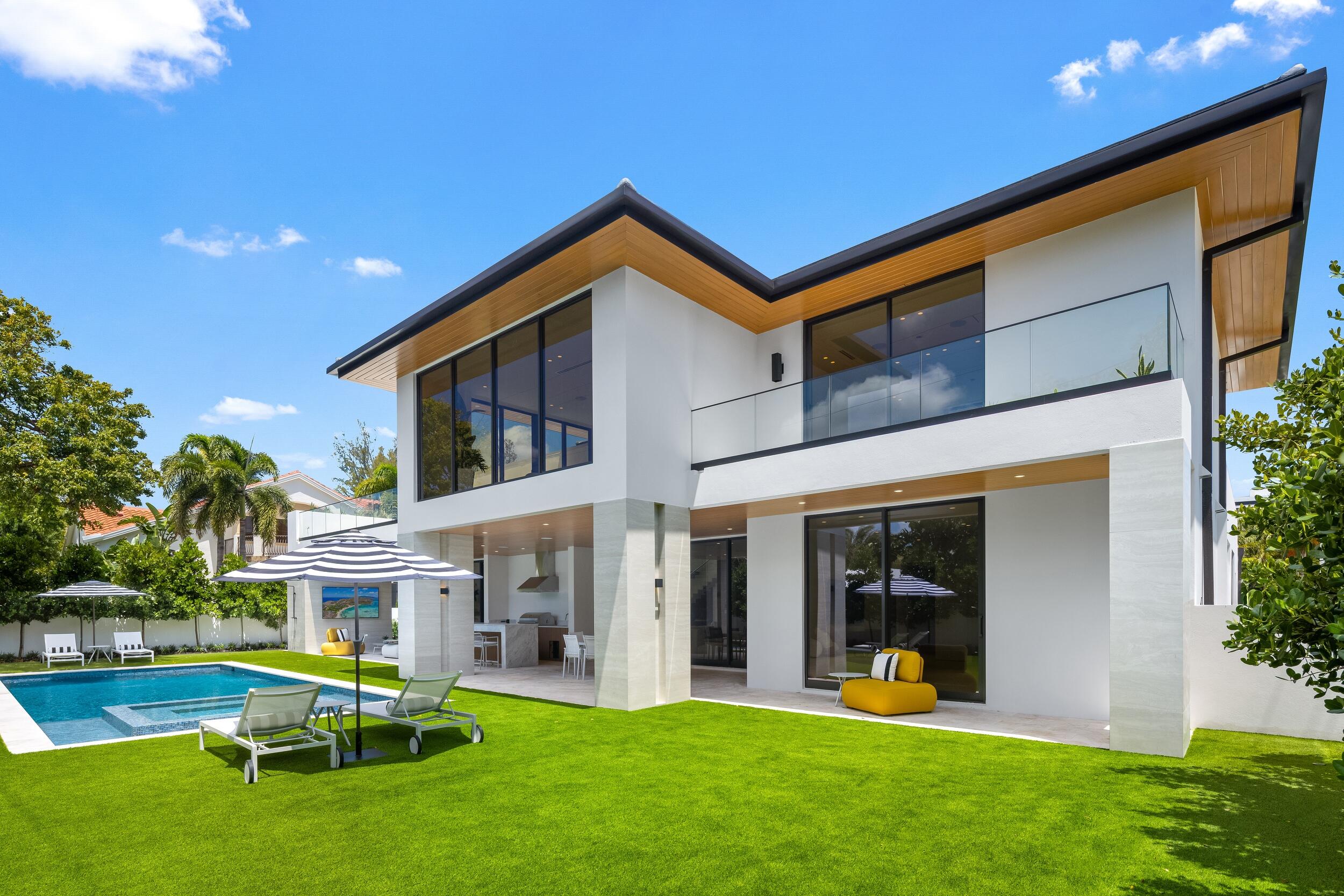 1351 Cocoanut Road Boca Raton, FL 33432 - Photo 56 of 101 a view of a house with a yard and sitting area