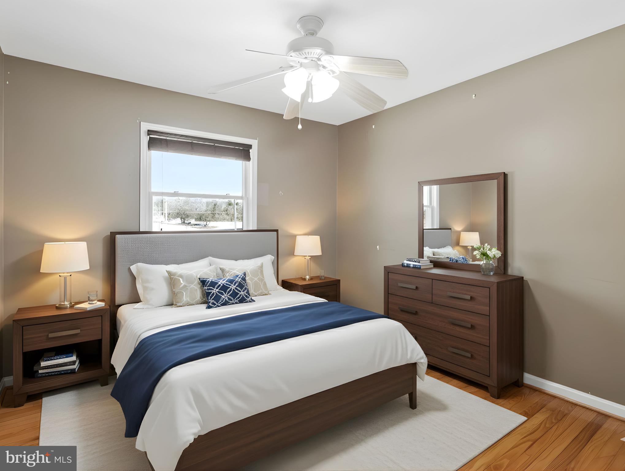 15295 Woodville Road Waldorf, MD 20601 - Photo 15 of 32 a bedroom with a bed and a chandelier