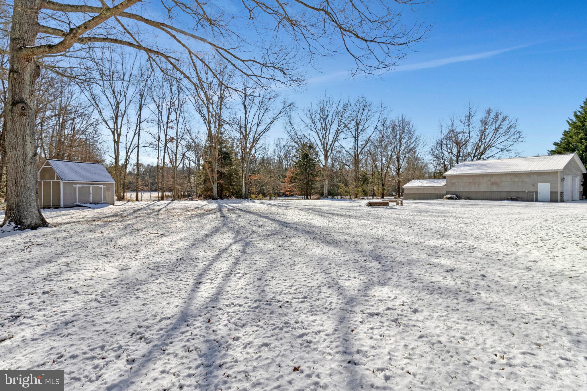 15295 Woodville Road Waldorf, MD 20601 - Photo 31 of 32 a wooden bench sitting in middle of a yard