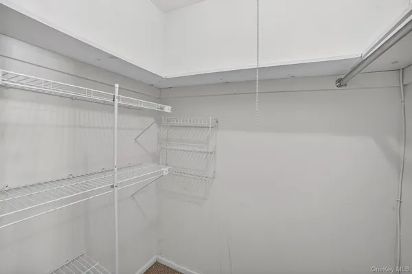 a view of a room with racks on the wall