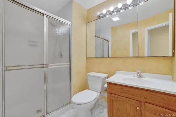 a bathroom with a toilet sink and shower