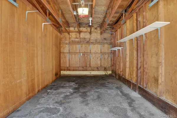 a view of a room with a wooden door and deck