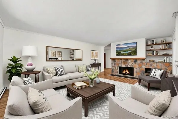 a living room with furniture and a fireplace