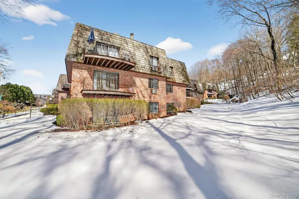 a view of a building with a snow in front of it