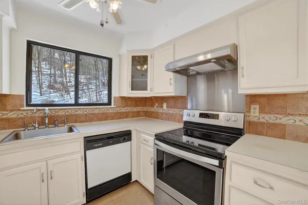 a kitchen with a stove and a sink