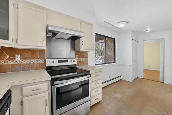 a kitchen with a stove and a cabinet