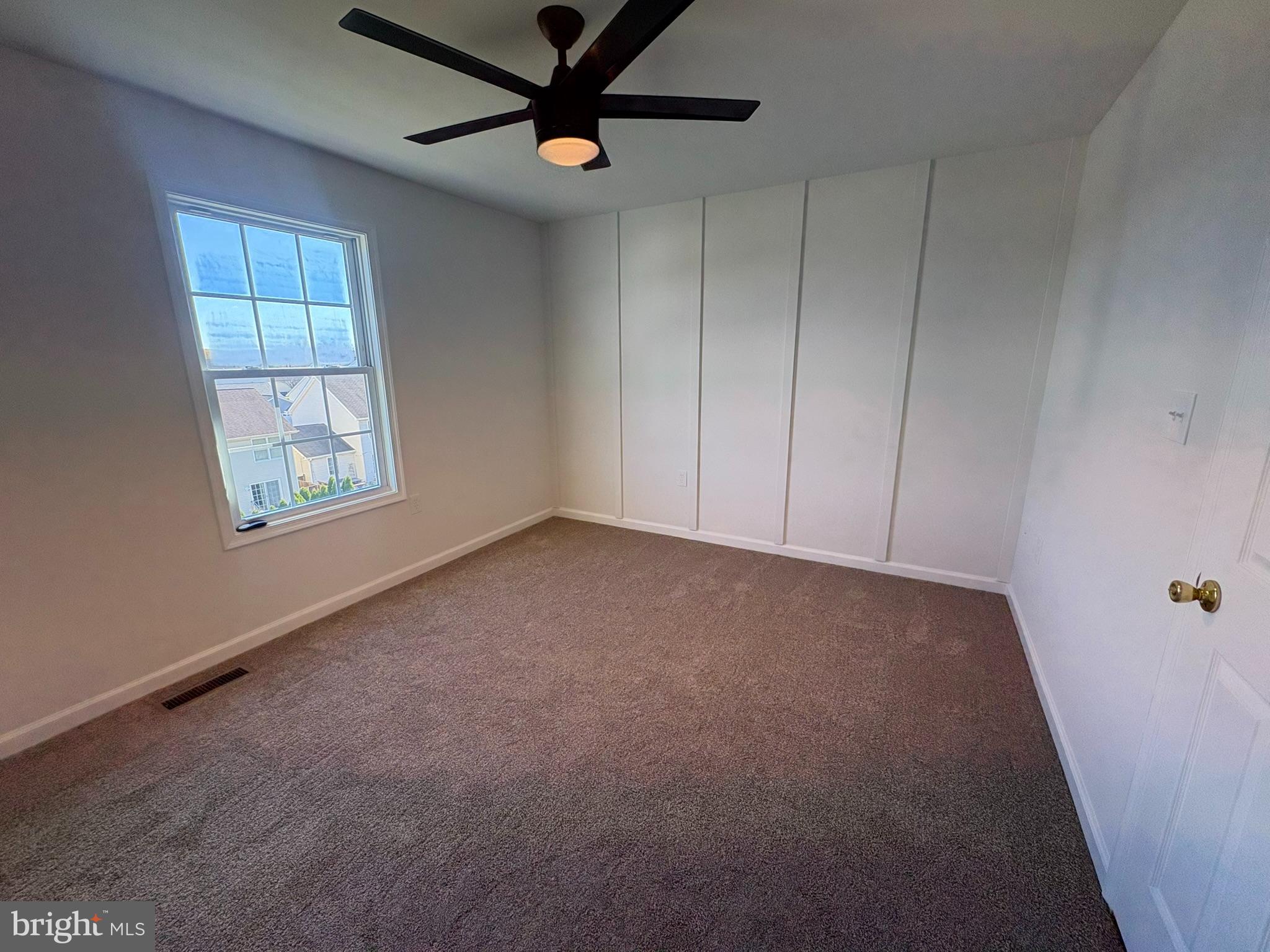 55 Fuzzy Tail Drive Ranson, WV 25438 - Photo 12 of 20 an empty room with windows and fan