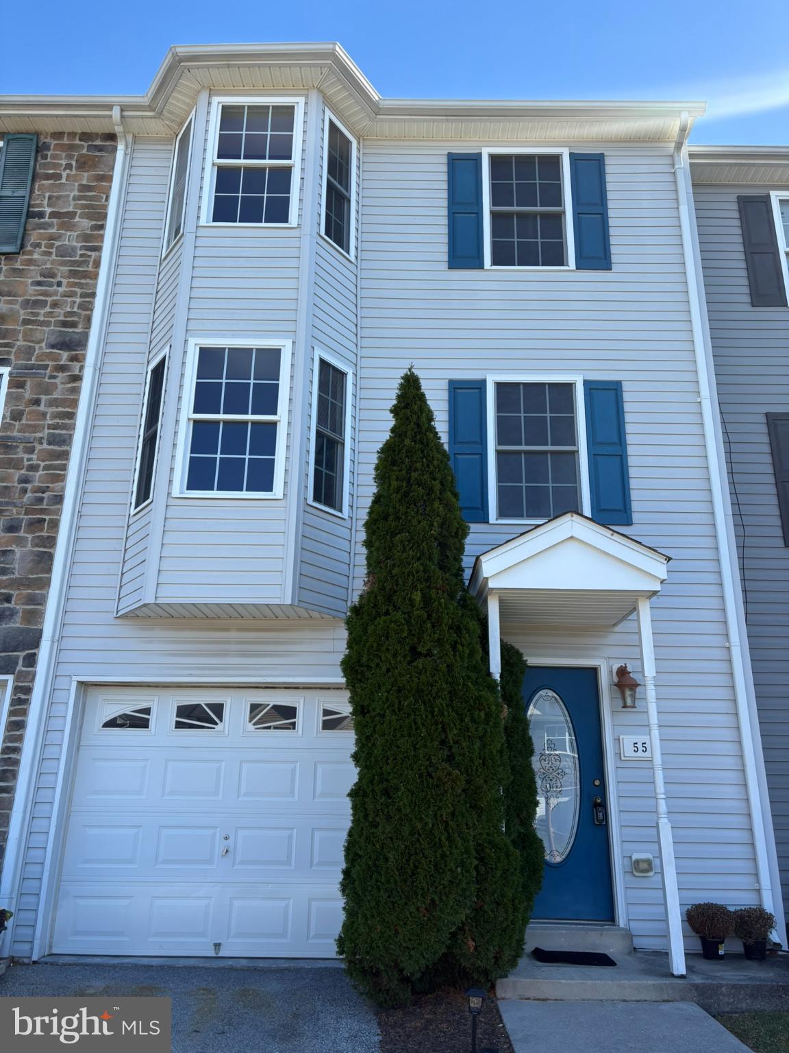55 Fuzzy Tail Drive Ranson, WV 25438 - Photo 4 of 20 a front view of a house with a garden
