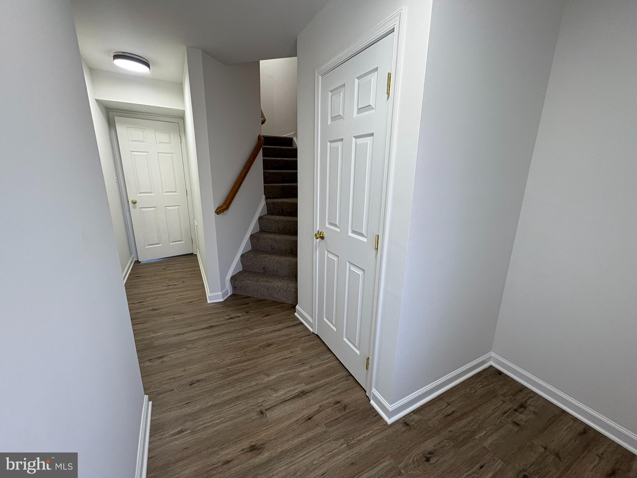 55 Fuzzy Tail Drive Ranson, WV 25438 - Photo 5 of 20 a view of a hallway with wooden floor and entryway