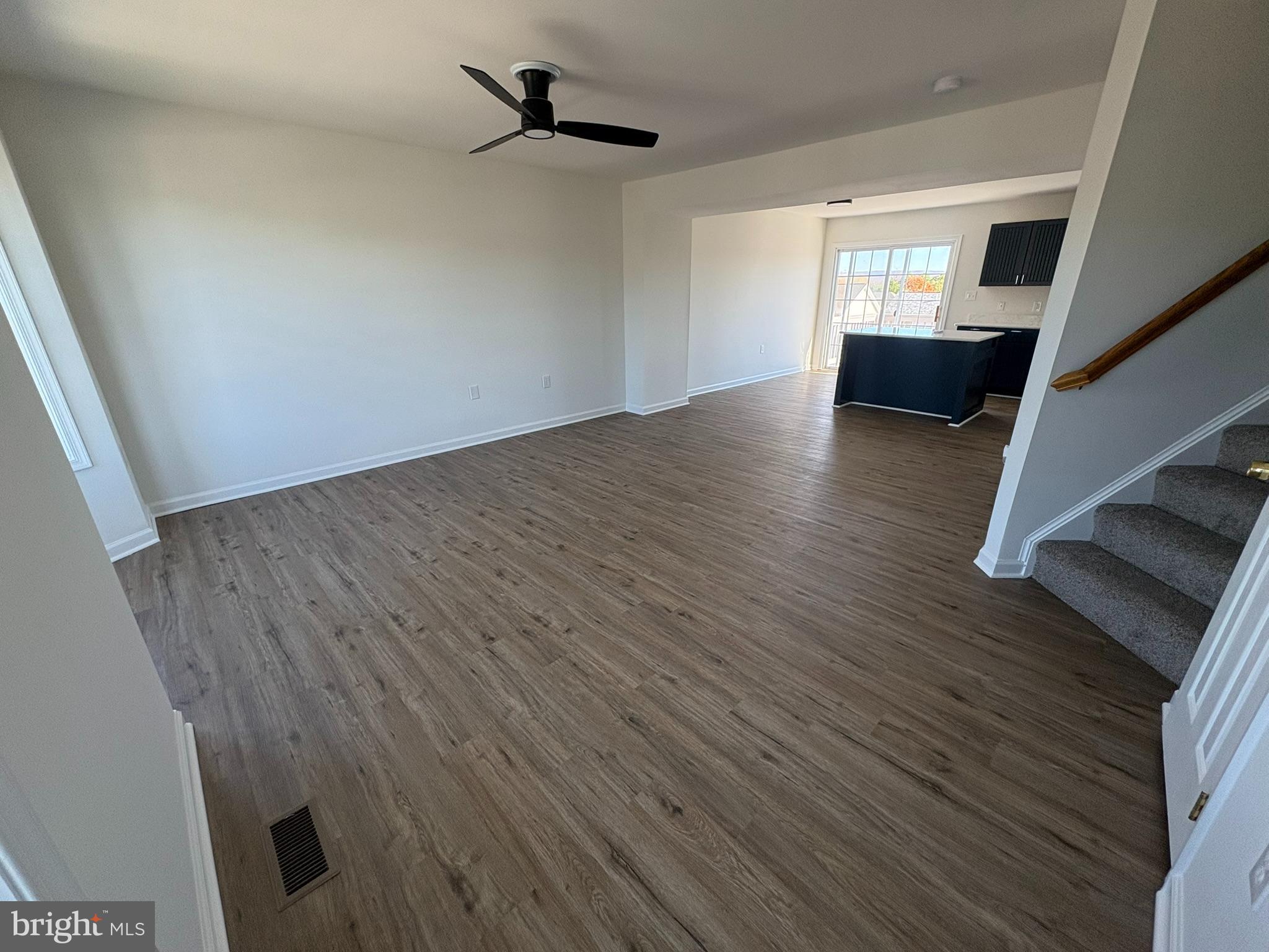 55 Fuzzy Tail Drive Ranson, WV 25438 - Photo 9 of 20 wooden floor in an empty room with a window