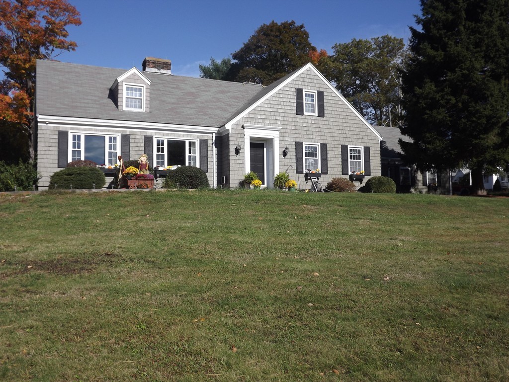 33 Fiske Hill Road Sturbridge, MA 01566 - Photo 1 of 29 a front view of a house with a garden