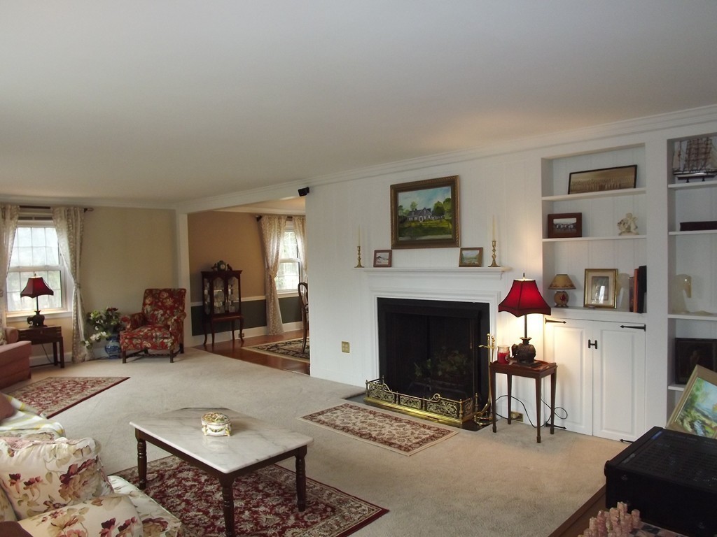 33 Fiske Hill Road Sturbridge, MA 01566 - Photo 7 of 29 a living room with furniture and a fireplace