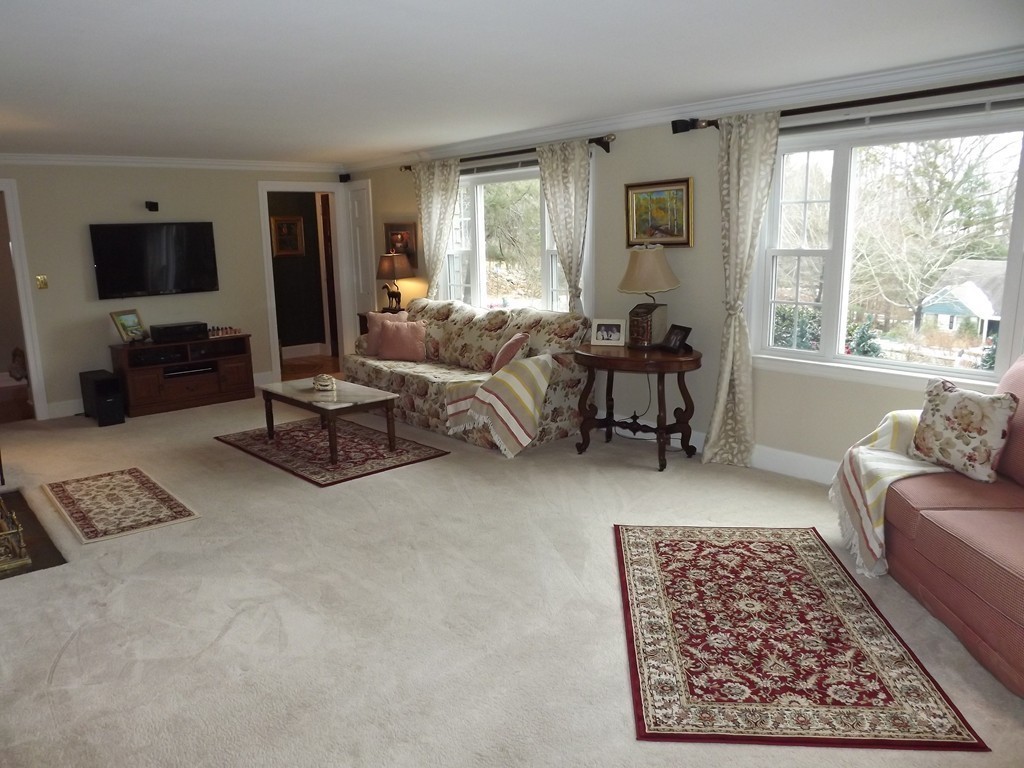 33 Fiske Hill Road Sturbridge, MA 01566 - Photo 9 of 29 a living room with furniture and a flat screen tv