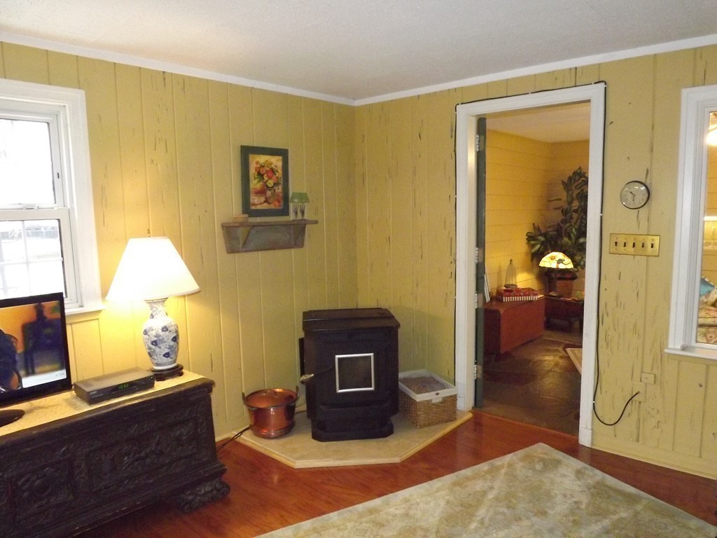 33 Fiske Hill Road Sturbridge, MA 01566 - Photo 10 of 29 a bedroom with a bed and wooden floor