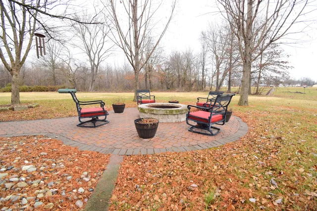a view of two chairs in a patio