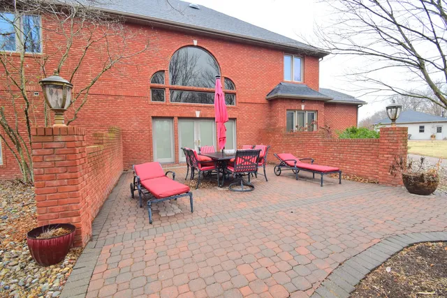 a view of a swimming pool with an outdoor seating