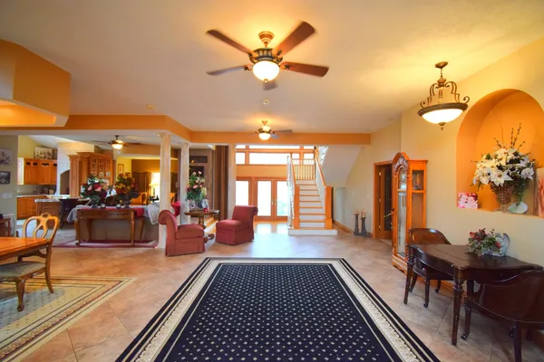 a view of hall way with furniture