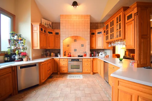 a kitchen with a sink stove and cabinets