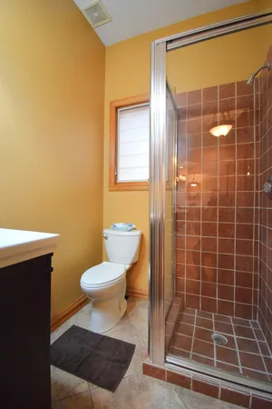 a bedroom with a bed and ceiling fan