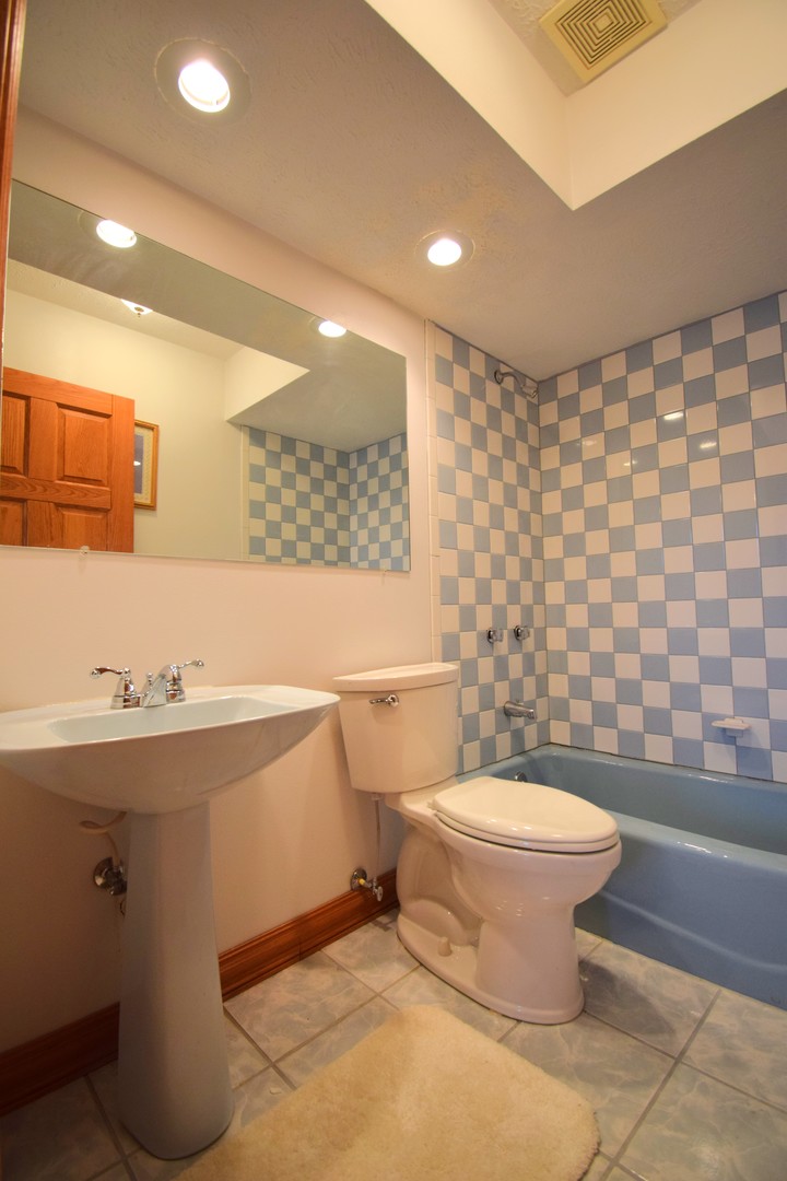 12863 Bowling Alley Road Benton, IL 62812 - Photo 40 of 50 a bathroom with a sink toilet and shower