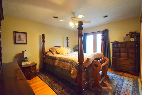 a bathroom with a double vanity sink toilet and shower