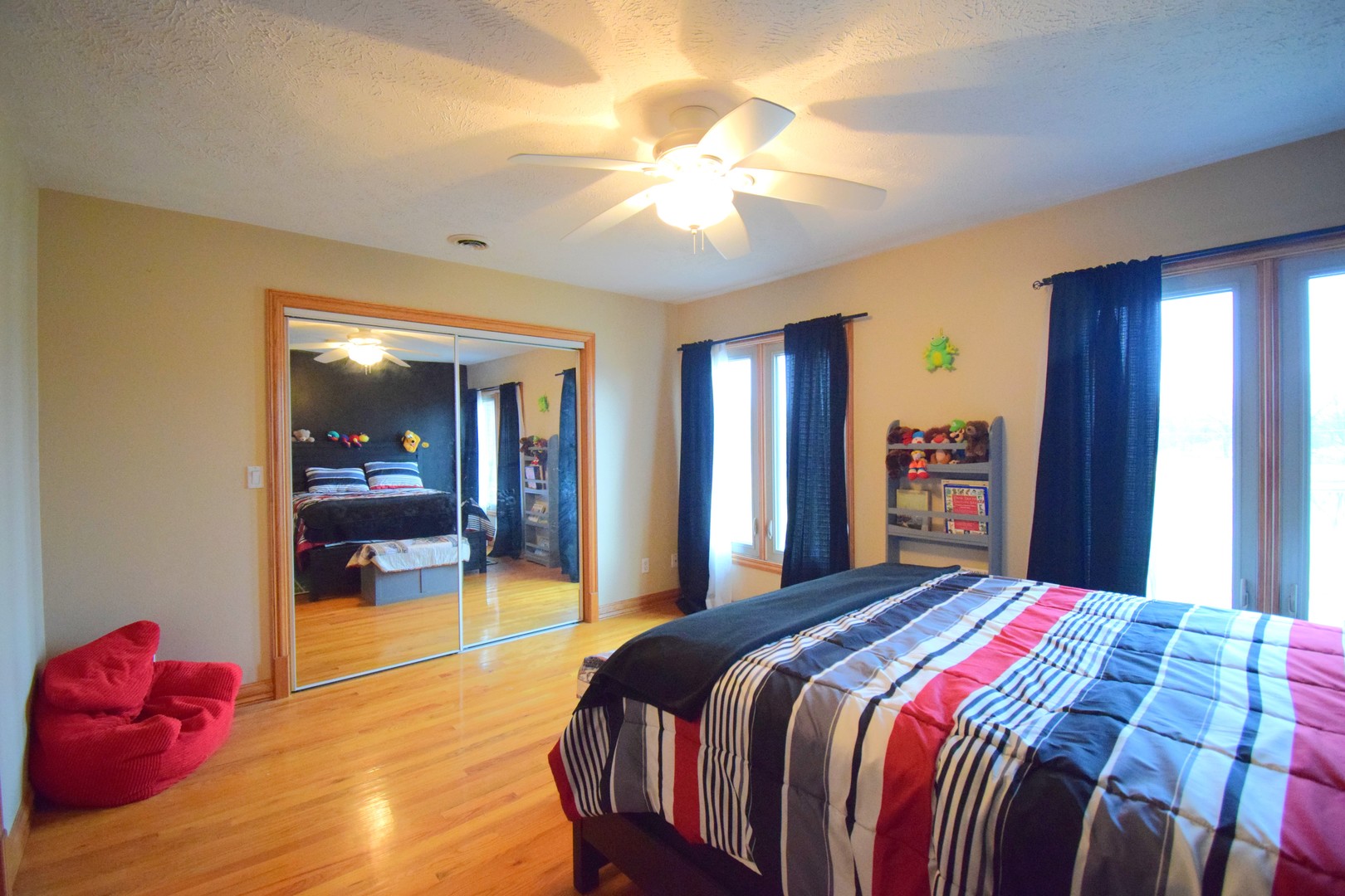 12863 Bowling Alley Road Benton, IL 62812 - Photo 44 of 50 a bedroom with a large bed and a chandelier