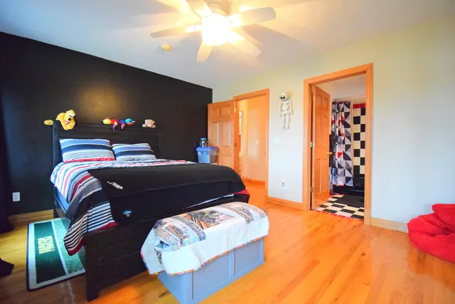 a bedroom with a bed and window