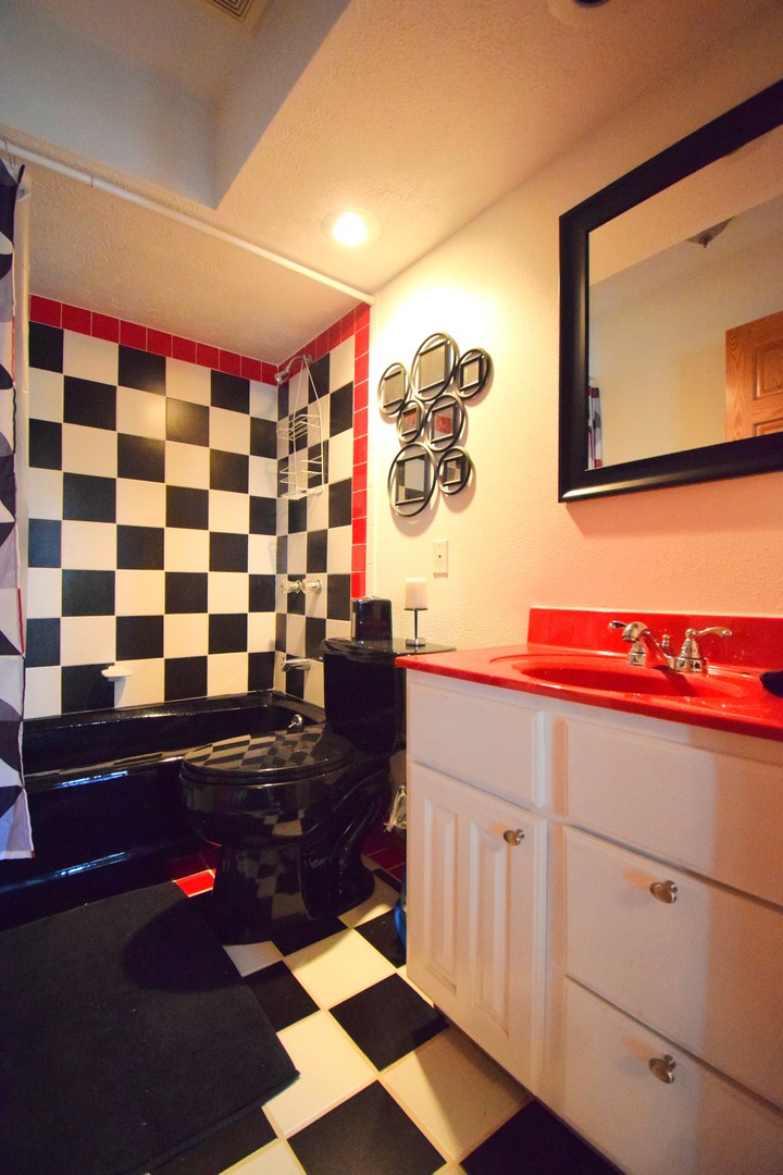 12863 Bowling Alley Road Benton, IL 62812 - Photo 46 of 50 a bathroom with a sink and a mirror