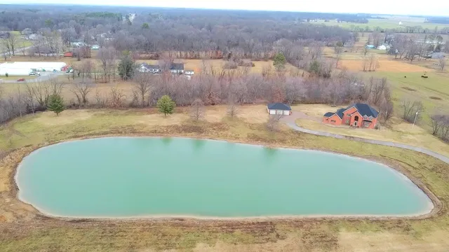 a view of a swimming pool with a lake view