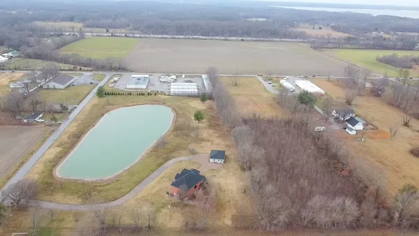 a view of a lake with houses in the back