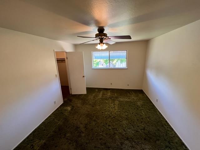 696 McCarty Avenue Mountain View, CA 94041 - Photo 22 of 31 an empty room with windows and fan
