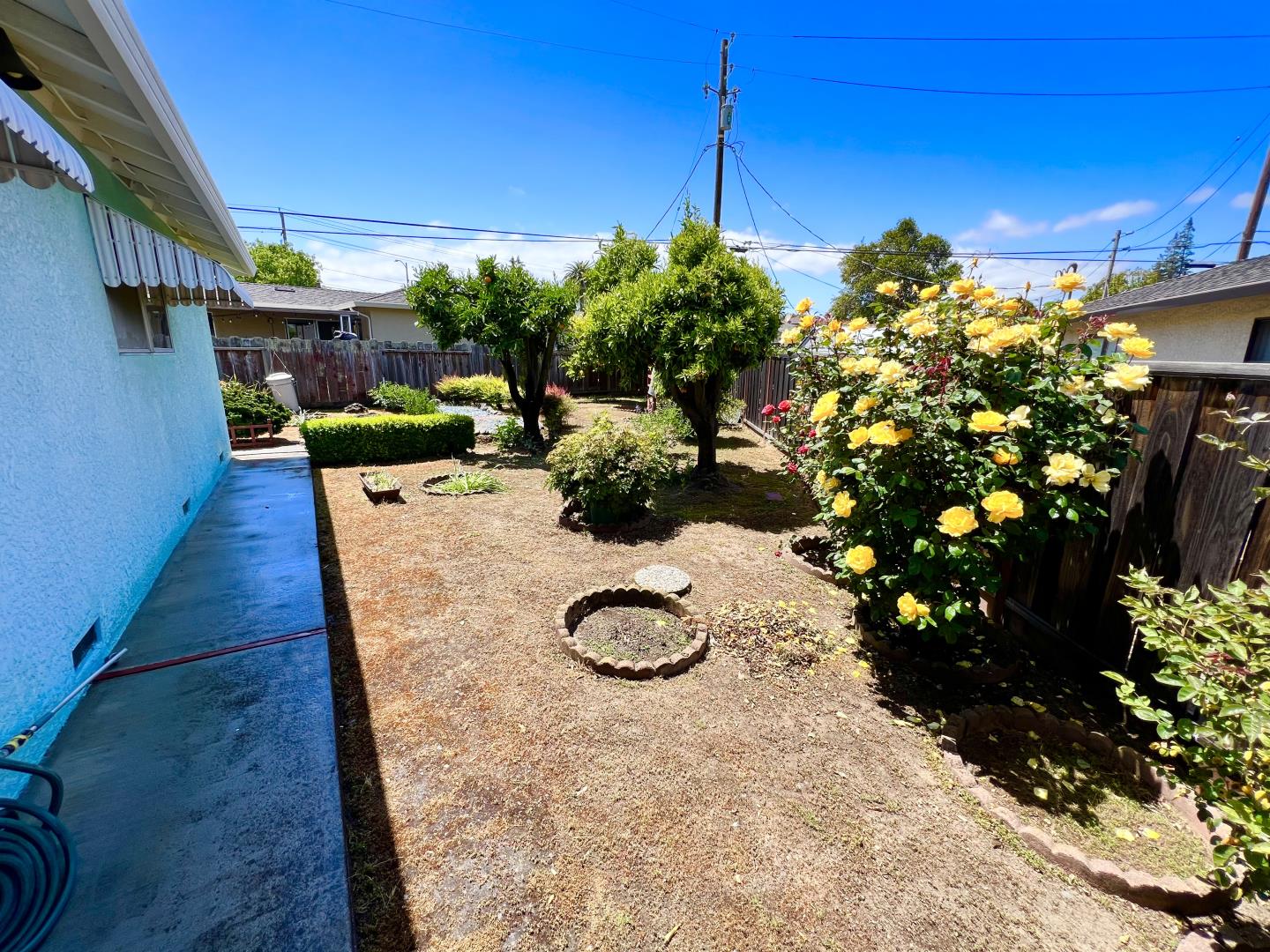 696 McCarty Avenue Mountain View, CA 94041 - Photo 23 of 31 a backyard of a house with lots of green space