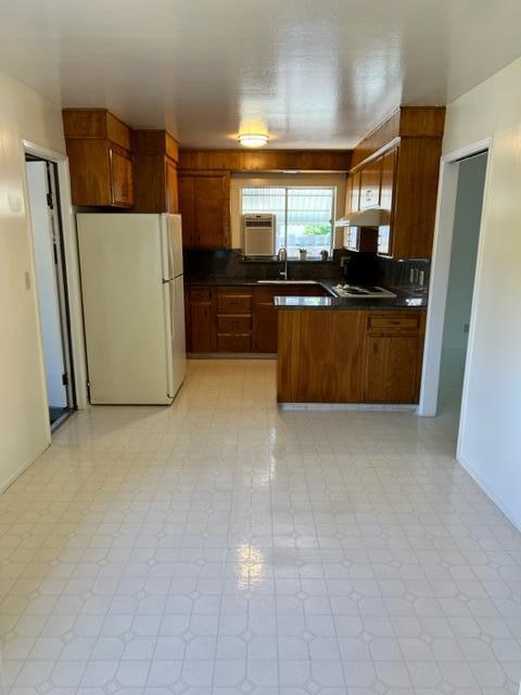 696 McCarty Avenue Mountain View, CA 94041 - Photo 7 of 31 a kitchen with stainless steel appliances a refrigerator a sink a stove top oven a counter space and cabinets