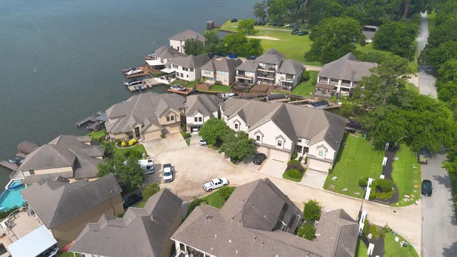 an aerial view of a house with yard swimming pool and outdoor seating