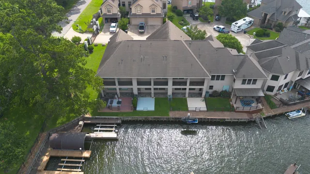an aerial view of a house with garden space and street view