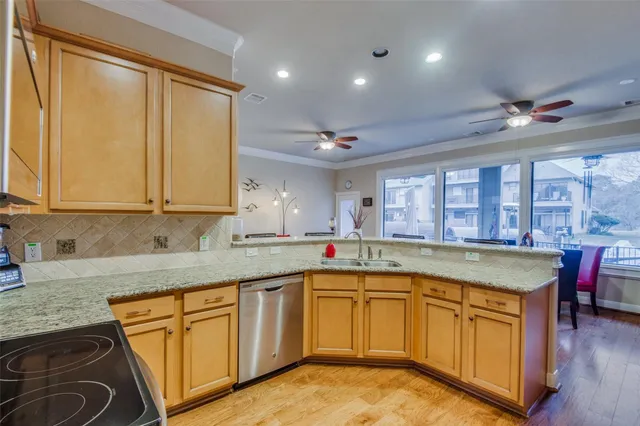 a kitchen with a sink stove and cabinets
