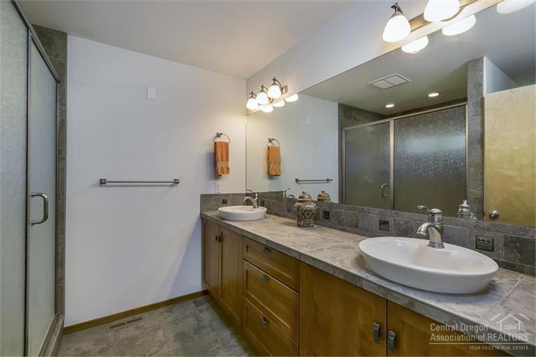 60366 Arnold Market Road Bend, OR 97702 - Photo 22 of 25 a bathroom with a double vanity sink and a mirror